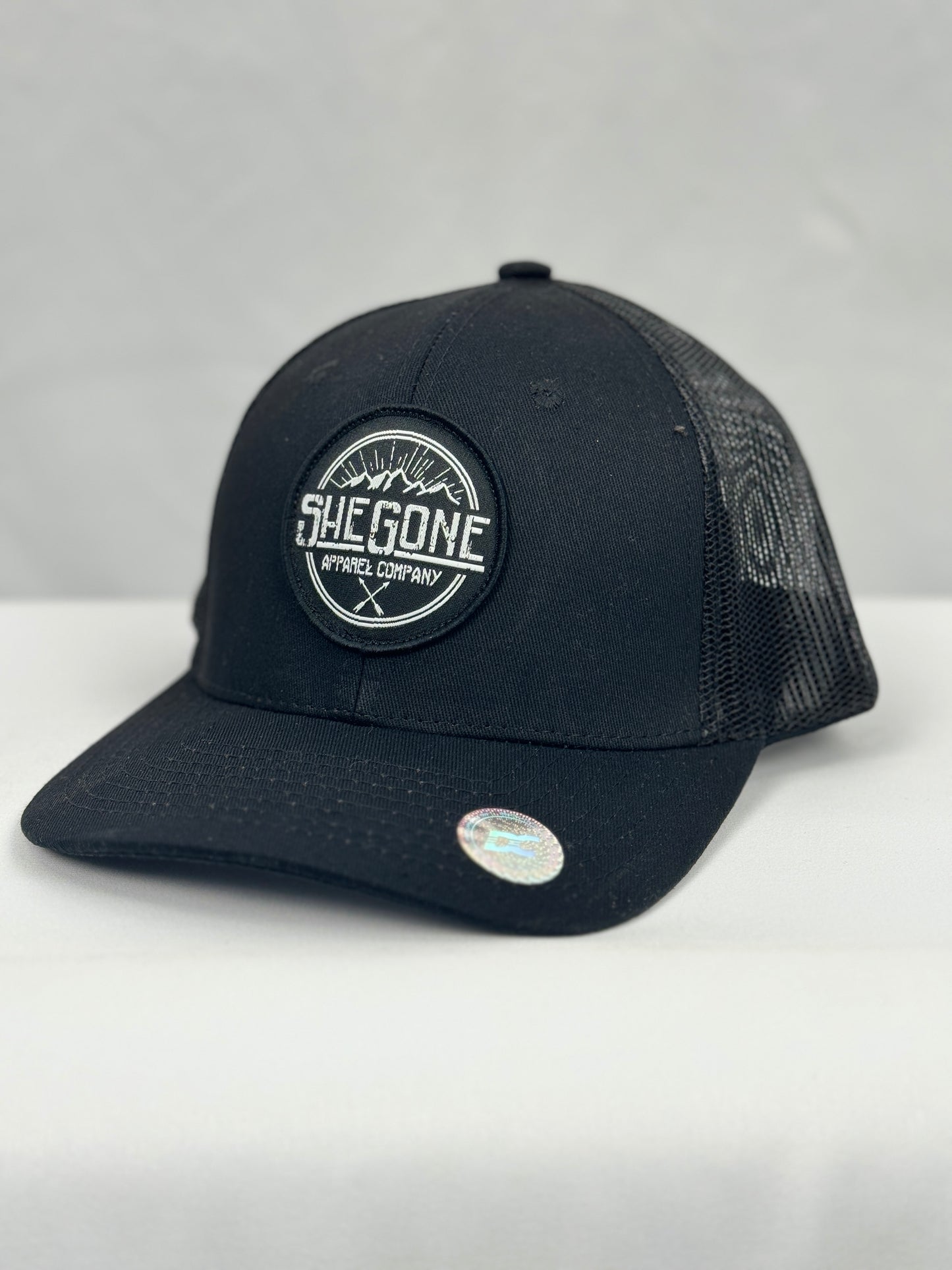 Woven SheGone Circle Patch on 112 Premium Trucker Cap - Black/ Black