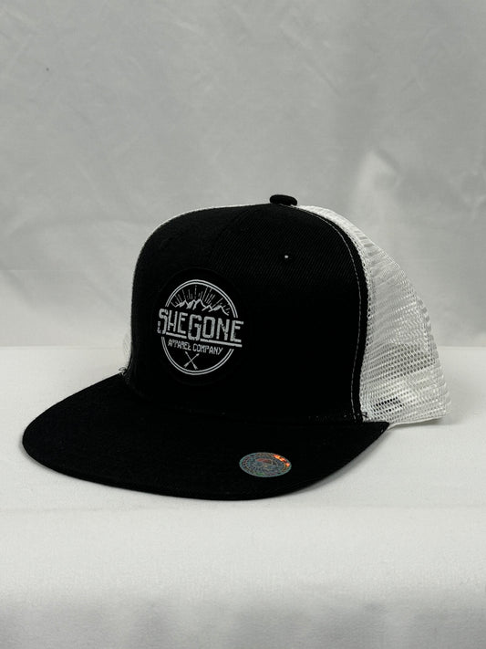 Woven SheGone Circle Patch on 8638 Flat Bill Trucker Cap - Black/ White